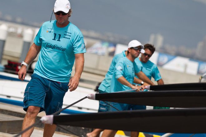 Neal McDonald, skipper Iker Martinez and the Team Telefonica shore crew change their rigging, prior to the start of the Sanya Haitang Bay In Port Race - Volvo Ocean Race 2011-12 © Ian Roman/Volvo Ocean Race http://www.volvooceanrace.com